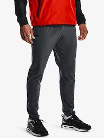 Męskie spodnie dresowe Under Armour  Storm STRETCH WOVEN PANT-GRY